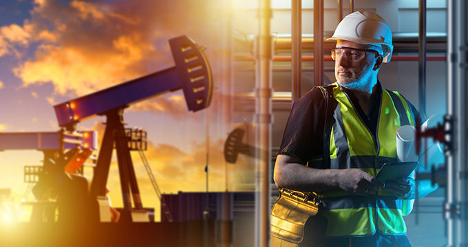 industrial worker in safety gear with blueprints observing oil drilling equipment against a sunset background showcasing 5 key elements of safety